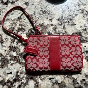 Coach wristlet. Logo fabric with Leather trim. Pre-Owned Condition-Excellent
